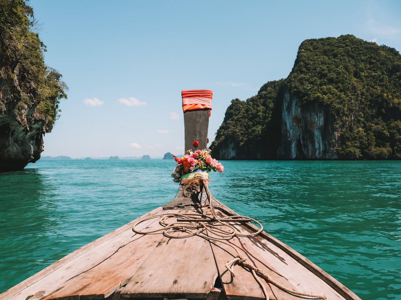 services-08 Explore stunning turquoise waters in Krabi, Thailand aboard a traditional longtail boat.